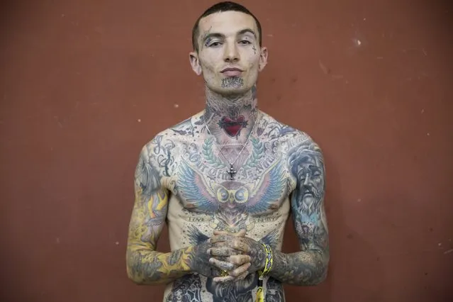 Tattoo artist “Raw” poses for a portrait during the Great British Tattoo Show in Alexandra Palace in north London, Britain May 23, 2015. (Photo by Neil Hall/Reuters)