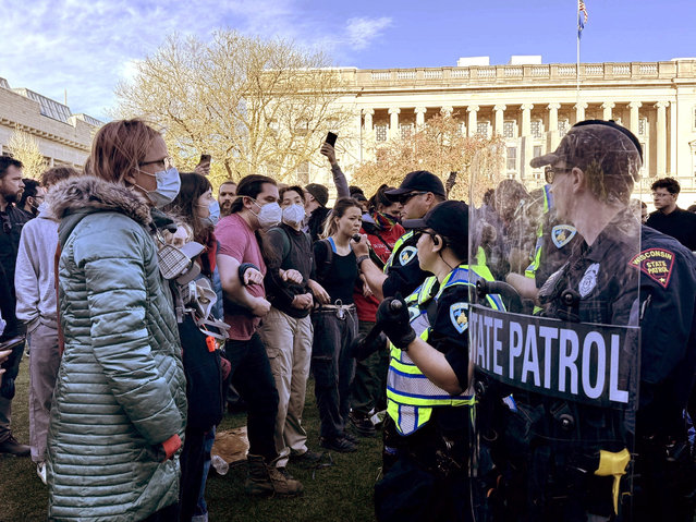 Police face off against pro-Palestinian supporters at an encampment on the Library Mall of the University of Wisconsin in Madison, Wisconsin, on May 1, 2024. (Photo by Laura Schulte/Milwaukee Journal Sentinel/USA Today Network via Reuters)