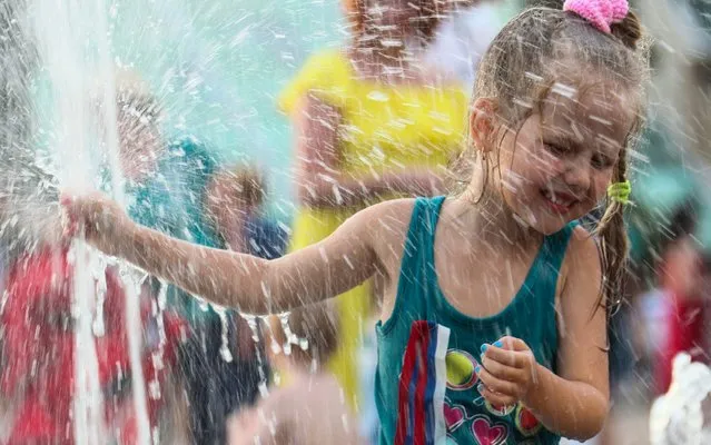 A girl in a fountain in Flag Square in Sochi, Russia on June 12, 2019. (Photo by Dmitry Feoktistov/TASS)