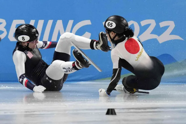 Kristen Santos, left, of the United States, and Sumire Kikuchi, of Japan, crash in their quarterfinal of the women's 500-meter during the short track speedskating competition at the 2022 Winter Olympics, Monday, February 7, 2022, in Beijing. (Photo by Bernat Armangue/AP Photo)