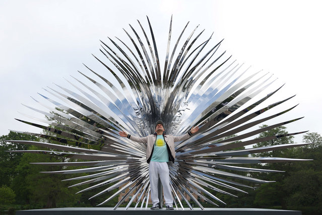 British artist Marc Quinn poses in front of a sculpture called “Event Horizon (Sabal)”, part of “Light into Life”, a new exhibition of sculptures by Quinn, at Kew Gardens in London, Britain, May 1, 2024. (Photo by Toby Melville/Reuters)