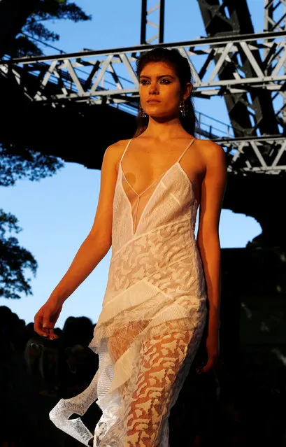 A model presents an outfit during the Manning Cartel show under the Sydney Harbour Bridge during Australian Fashion week, May 17, 2016. (Photo by Jason Reed/Reuters)