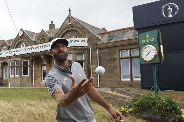 Dustin Johnson of the United States throws his ball into the crowd as he walks off the 18th green during his second round of the British Open Golf Championships at Royal Troon golf club in Troon, Scotland, Friday, July 19, 2024. (Photo by Scott Heppell/AP Photo)