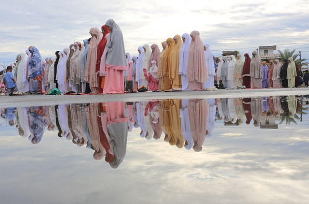 Indonesian Muslims offer mass prayers at Baitul Makmur Grand Masque during Eid al-Adha celebrations in Meulaboh, West Aceh regency, Indonesia, on June 17, 2024, in this photo taken by Antara Foto. (Photo by Syifa Yulinnas/Antara Foto via Reuters)