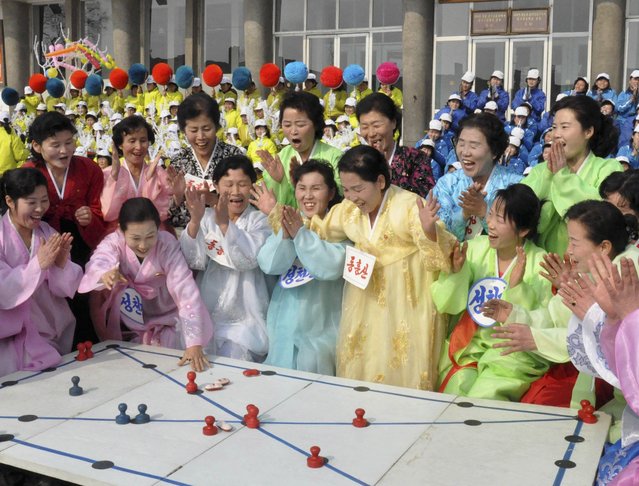 North Koreans celebrate Lunar New Year in this February 19, 2015 photo released by North Korea's Korean Central News Agency (KCNA) in Pyongyang February 19, 2015. (Photo by Reuters/KCNA)