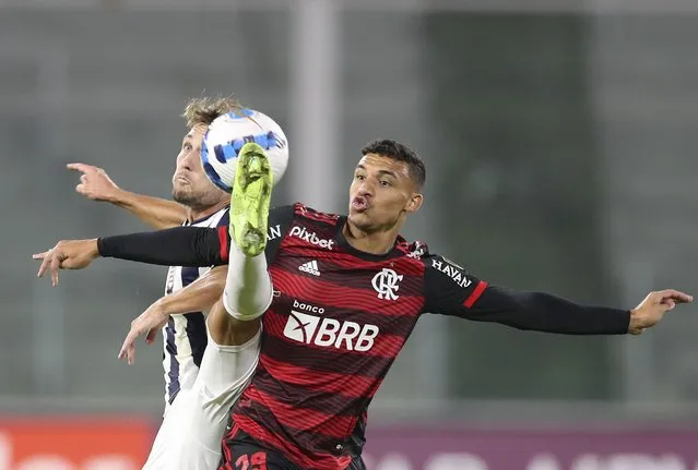 Victor Hugo of Brazil's Flamengo, right, and Angelo Martino of Argentina's Talleres battle for the ball during a Copa Libertadores soccer match in Cordoba, Argentina, Wednesday, May 4, 2022. (Photo by Nicolas Aguilera/AP Photo)