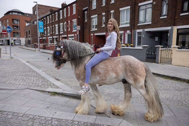 Lucy McGarry, 16, rides bareback on a horse at Smithfield horse fair, in Dublin, Ireland on September 1, 2024. (Photo by Clodagh Kilcoyne/Reuters)