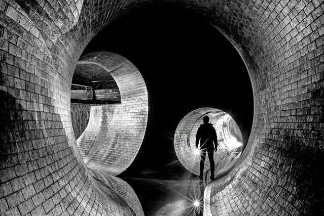 Mike Deere captured this eerie shot of a sewer tunnel near the the River Westbourne in London. His collection shows the scale of some of Britains deepest darkest wonders. (Photo by Mike Deere/Caters News)