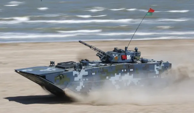 A Chinese armoured personnel carrier (APC) drives on a course of the Caspian Derby-2015 international naval contest during the International Army Games-2015 in the Dagestan's port city of Kaspiysk, Russia, August 5, 2015. (Photo by Sergei Karpukhin/Reuters)