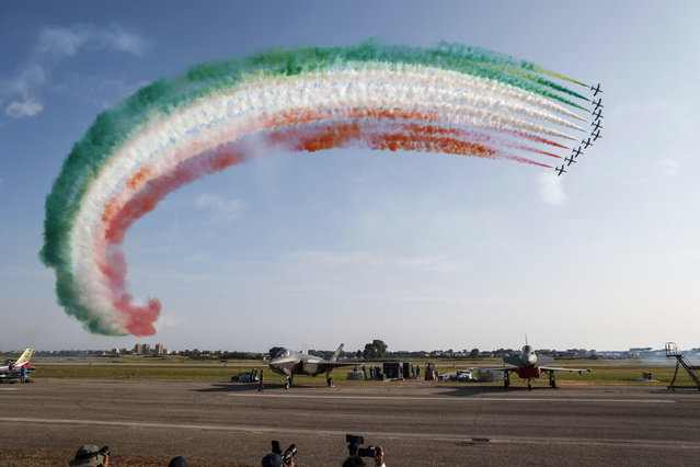 Italian Air Forces' aerobatic team Frecce Tricolori perform during an airshow at the Mario De Bernardi military airport in Pratica di Mare on the occasion of the centenary of the Italian Air Force, near Rome, Italy, 17 June 2023. (Photo by Giuseppe Lami/EPA)