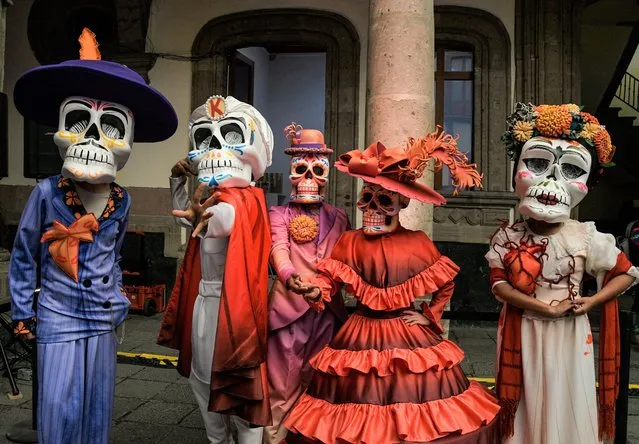 Volunteers pose during the press conference to announce the International Day of the Dead Parade “Dia de Muertos” at the Museum of Mexico City on October 10, 2021. The parade will have more than 1000 participants including musicians, acrobatic dancers and 10 allegorical floats with a 9 kilometer route from El Zocalo to Campo Marte. (Photo by Aidee Martinez/Eyepix Group/Rex Features/Shutterstock)