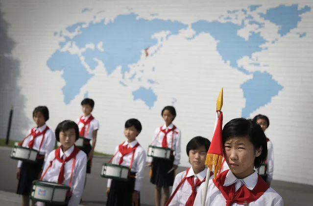 North Korean school girls stand in formation during an opening ceremony for the start of summer activities at the Songdowon International Children's Camp, Tuesday, July 29, 2014, in Wonsan, North Korea. The camp, which has been operating for nearly 30 years, was originally intended mainly to deepen relations with friendly countries in the Communist or non-aligned world. But officials say they are willing to accept youth from anywhere – even the United States. (Photo by Wong Maye-E/AP Photo)