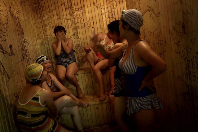 Women who work at the Kim Jong Suk Pyongyang textile factory spend their free time in a sauna at their dormitory, in Pyongyang, North Korea, on Jule 31, 2014. The factory is the country's largest textile factory with 8,500 workers, and 80 percent of them are women. (Photo by Wong Maye-E/Associated Press)