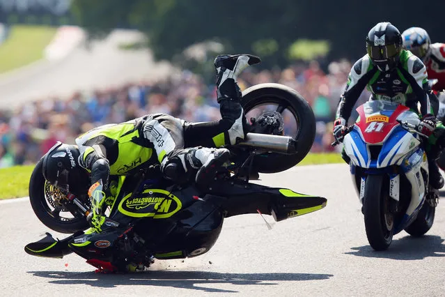 Ben Godfrey of Great Britain and BPG Racing crashes out of the Pirelli National Superstock 1000 Championship race during the MCE British Superbike Championship at Cadwell Park on August 23, 2015 in Louth, England. (Photo by Bryn Lennon/Getty Images)