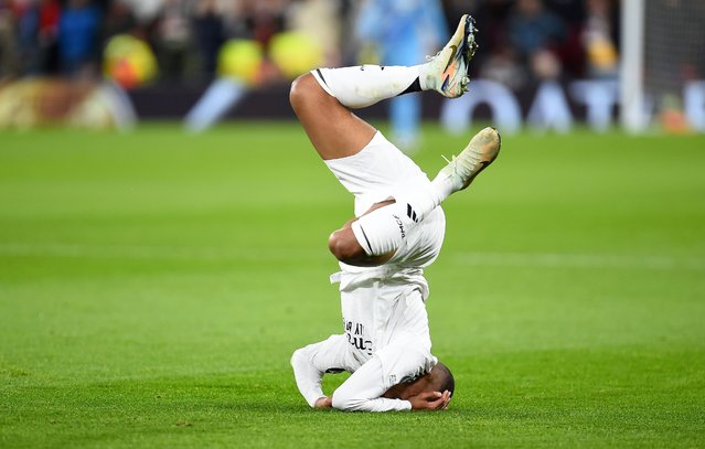 Kylian Mbappe of Real Madrid falls to the pitch during the UEFA Champions League match between Liverpool and Real Madrid in Liverpool, Britain, 27 November 2024. (Photo by Peter Powell/EPA)