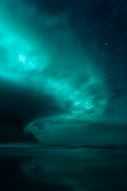 “Aurorae”. Winner: Ghost World by Mikkel Beiter (Denmark) During October 2016 the photographer stood and observed the waves from the sea slowly rolling up on the long beach making the sand wet, resulting in great conditions for catching some reflections. Suddenly, clouds emerged from the nearby mountains and floated across the sea allowing him to capture this other-worldly scene of a powerful, teal aurora sweeping across the night sky. Stokksnes, Iceland. Stokksnes, Iceland, 5 October 2016 Canon EOS 5D Mark III camera, 24 mm f/2.0 lens, ISO 1600, 6-second exposure. (Photo by Mikkel Beiter/Insight Astronomy Photographer of the Year 2017)