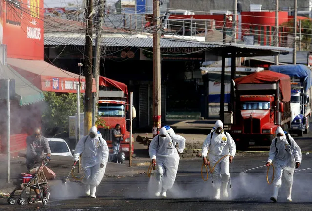 Workers use ozone to sanitize the Food Market area in Guadalajara, Mexico, as a preventive measure against the spread of the novel coronavirus COVID-19, on April 28, 2020. More than 214,451 people have died worldwide since the epidemic surfaced in China in December, according to an AFP tally at 1900 GMT on Tuesday based on official sources. (Photo by Ulises Ruiz/AFP Photo)