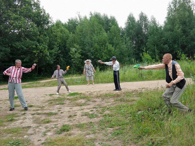 Patients from one of the psychiatric facilities in the small Russian town of Elat’ma participate in organized activities such as water gun fights. (Photo by Anastasia Rudenko)