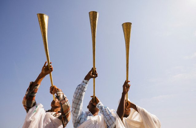 Ethiopian Orthodox faithful blow traditional trumpets during the annual Epiphany celebration called “Timket” to commemorate Jesus Christ's baptism in the Jordan River by John the Baptist, in Batu, Ethiopia, on January 19, 2025. (Photo by Tiksa Negeri/Reuters)