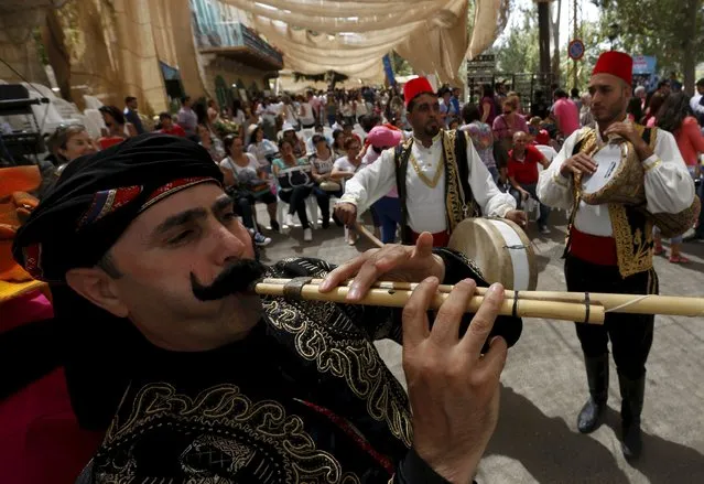 A traditional musical group performs during a traditional dance festival held in Maaser al Shouf  village in Mount Lebanon September 13, 2015. (Photo by Jamal Saidi/Reuters)