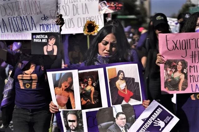 Feminist groups march to protest the murder of Ariadna Lopez, in Mexico City, Monday, November 7, 2022. Prosecutors said Sunday an autopsy on Lopez who was found dead in the neighboring state of Morelos, showed she was killed by blunt force trauma. That contradicts a Morelos state forensic exam that suggested the woman choked on her own vomit as a result of intoxication. (Photo by Marco Ugarte/AP Photo)