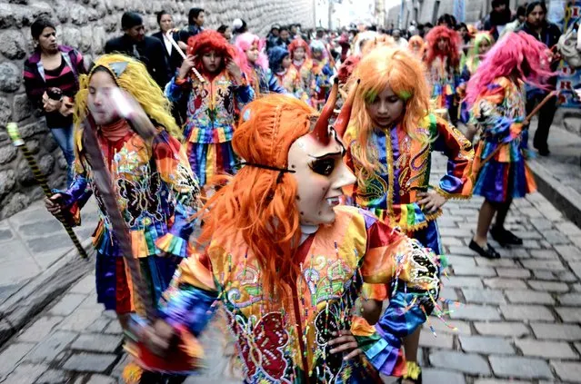 Girls parade during the Saint Rose of Lima -patroness of Peru- annual festival in Cusco, Peru on August 26, 2016. Saint Rose of Lima dedicated her life to caring for the sick and was the first person born in the Americas to be canonized by the Roman Catholic Church. (Photo by Goh Chai Hin/AFP Photo)