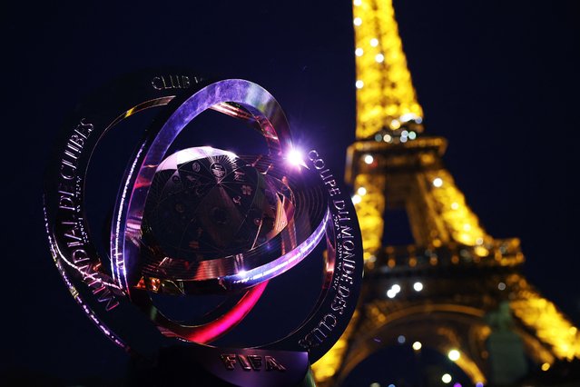 This photograph shows the FIFA Club World Cup trophy during a presentation aboard a riverboat on the Seine river, in front of the Eiffel Tower in Paris on April 3, 2025. (Photo by Franck Fife/AFP Photo)