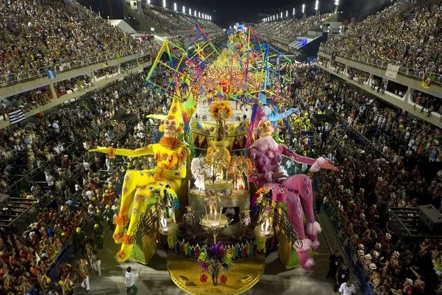 Revelers of Grande Rio samba school perform during the second night of Carnival parade at the Sambadrome in Rio de Janeiro, Brazil on February 12, 2013. (Photo by Antonio Scorza/AFP Photo)