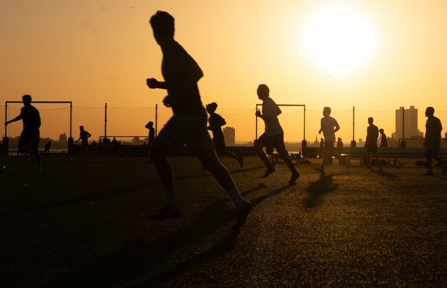People play soccer at a Brooklyn park at dusk at the end of the hottest day of the year so far on June 24, 2025 in New York City. Temperatures in New York reached into the high 90's with a heat index of over 100 degrees as the first heat wave of the year moves across parts of the Midwest and East Coast. (Photo by Spencer Platt/Getty Images)