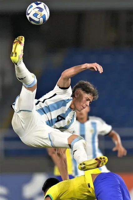 Argentina's Austin Giay jumps during a South America U-20 Championship soccer match against Brazil in Cali, Colombia, Monday, January 23, 2023. (Photo by Fernando Vergara/AP Photo)