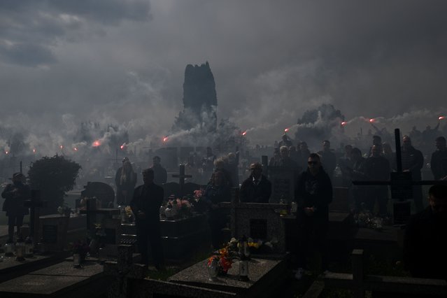 Mourners light flares during a funeral ceremony for Damian Sobol, a member of the US-based food charity World Central Kitchen, killed in an Israeli strike in Gaza, at the cemetery in his home town of Przemysl, Poland, on April 20, 2024. An Israeli bombardment killed seven staff of the US-based food charity World Central Kitchen on April 1, 2024 in an attack that the UN chief labelled "unconscionable" and "an inevitable result of the way the war is being conducted". (Photo by Sergei Gapon/AFP Photo)