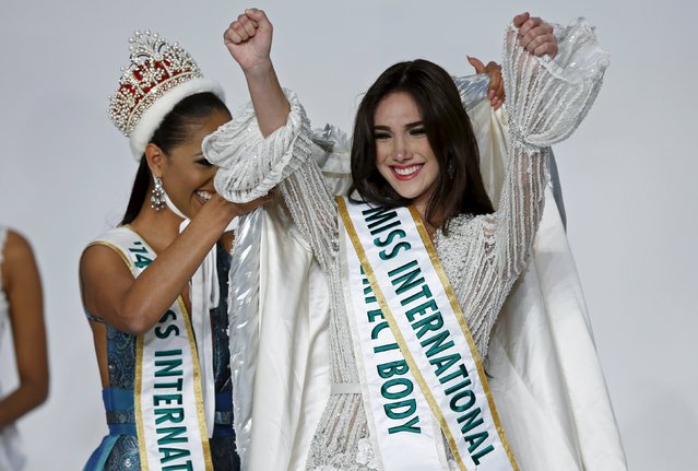 Edymar Martinez (R) representing Venezuela celebrates as she is awarded the gown by Miss International 2014 Valerie Hernandez Matias representing Puerto Rico after winning the 55th Miss International Beauty title during the 55th Miss International Beauty Pageant in Tokyo, Japan, November 5, 2015. (Photo by Toru Hanai/Reuters)