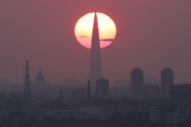 The sun sets behind the business tower Lakhta Centre, which is the headquarters of Russia's largest gas producer Gazprom, on hot day in Saint Petersburg, Russia on July 30, 2025. (Photo by Anton Vaganov/Reuters)