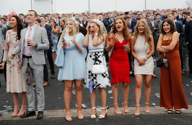 Racegoers react during the 14:50 Betway Mildmay Novices' Chase during Ladies Day at the Grand National Festival at Aintree Racecourse on April 13, 2018 in Liverpool, England. (Photo by Darren Staples/Reuters)