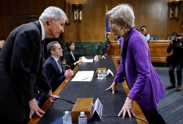 U.S. Senator Elizabeth Warren (D-MA) speaks to Federal Deposit Insurance Corporation Chairman Martin J. Gruenberg before a Senate Banking, Housing and Urban Affairs Committee hearing on “Recent Bank Failures and the Federal Regulatory Response” on Capitol Hill in Washington, U.S., March 28, 2023. (Photo by Evelyn Hockstein/Reuters)