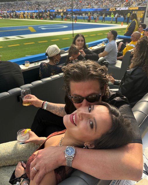 American actress Bella Thorne cuddles up with her beau while watching a game on October 23, 2025. (Photo by bellathorne/Instagram)