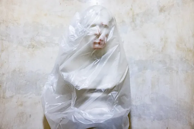 The bust of U.S. President Zachary Taylor is covered with plastic after blood was smeared on it when a pro-Trump mob broke into the U.S. Capitol building on January 7, 2021 in Washington, DC. Following a rally yesterday with President Donald Trump on the National Mall, a pro-Trump mob stormed and broke into the U.S. Capitol building causing a Joint Session of Congress to delay the certification of President-elect Joe Biden's victory over President Trump. (Photo by Samuel Corum/Getty Images)