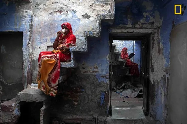“Sisters”. “These Rajasthani sisters were sitting inside their house relaxing and enjoying cups of masala chai”. (Photo by Firdaus Hadzri/National Geographic Travel Photographer of the Year Contest)