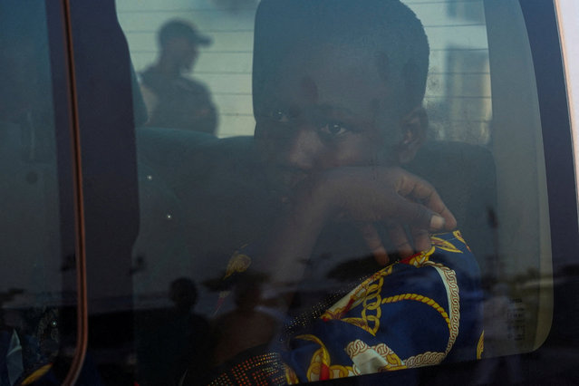 A rescued schoolchild from St. Mary's School sits inside a vehicle as students arrive at the Niger State Government House after being freed from captivity following their abduction by gunmen, in Minna, Nigeria, on December 8, 2025. (Photo by Marvellous Durowaiye/Reuters)