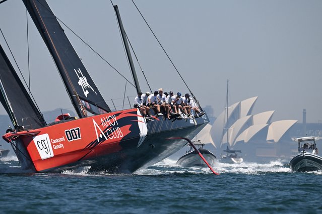Master Lock yacht crosses the finish line to win the 2025 SOLAS Big Boat Challenge on Sydney Harbour in Sydney on December 9, 2025. (Photo by Saeed Khan/AFP Photo)