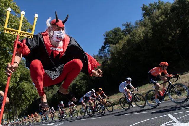 Cycling fan Didi Senft, aka El Diablo, cheers for the riders during the 7th stage of the 107th edition of the Tour de France cycling race, 168 km between Millau and Lavaur, on September 4, 2020. (Photo by Marco Bertorello/AFP Photo)