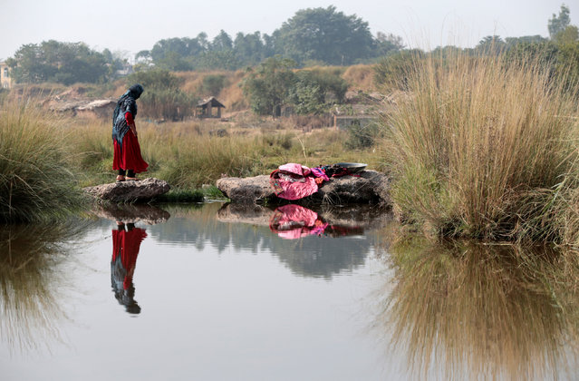 A woman prepares to do laundry in a river in Islamabad, Pakistan November 6,  2016. (Photo by Caren Firouz/Reuters)