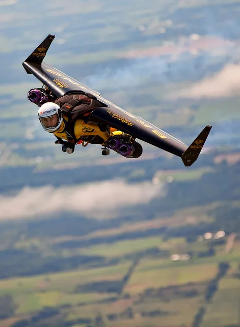 Jetman during a trial flight from Fond du Lac airport on Monday July 29, 2013. While skydiving several years ago Yves Rossy thought it would be cool to not just fall to earth but fly around with a jetpack on his back. So he invented one and will jump out of a helicopter over Oshkosh on Tuesday at AirVenture air and zoom around in his jetpack, his first public appearance in the U.S. (Photo by Mike Shore/Courtesy of Breitling)