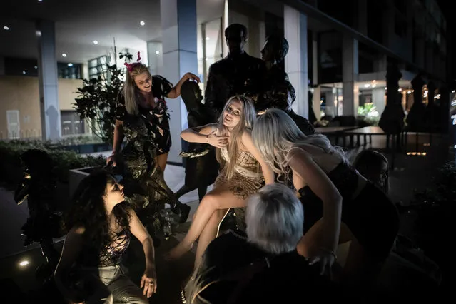 A bachelorette and her friends celebrate in Sydney’s Pyrmont district, Australia on October 18, 2018 outside the lockout zone, where alcohol sales are restricted between certain hours. Nearly five years after state legislation restricted the hours of alcohol service across the heart of Australia’s largest city, Sydney is again struggling over rules, risk, fun and freedom. (Photo by Brook Mitchell for The New York Times)