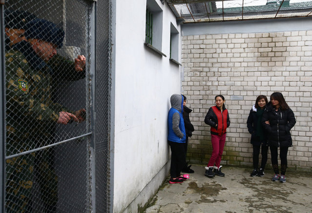 Vietnamese detained while attempting to cross the border illegally from Belarus to Lithuania, according to border officials, are seen in a temporary detention facility in Smorgon, Belarus, November 22, 2016. (Photo by Vasily Fedosenko/Reuters)