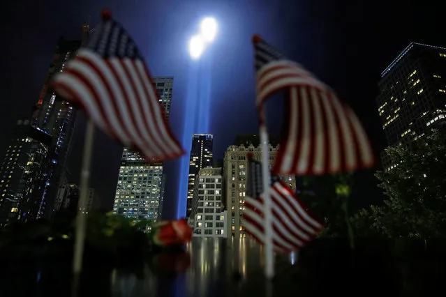 The Tribute in Light installation is illuminated over lower Manhattan as seen from The National September 11 Memorial & Museum marking the 17th anniversary of the 9/11 attacks in New York City, U.S., September 11, 2018. (Photo by Andrew Kelly/Reuters)