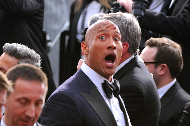 Dwayne Johnson arrives at the Oscars on Sunday, February 22, 2015, at the Dolby Theatre in Los Angeles. (Photo by Vince Bucci/Invision/AP Photo)