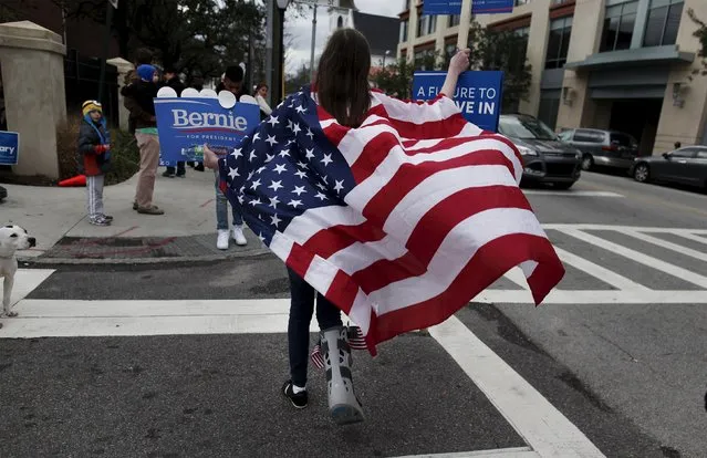 Mary Smith, a Bernie Sanders supporter from Charleston, walks along Calhoun Street before the start of the NBC News-YouTube Democratic Debate in Charleston, South Carolina, January 17, 2016. (Photo by Randall Hill/Reuters)