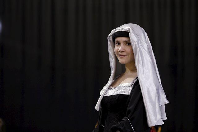 A woman stands in a medieval costume during an international medieval tournament in Tel Aviv, January 23, 2016. (Photo by Baz Ratner/Reuters)