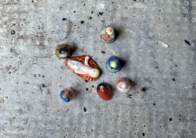 A Nativity scene is seen on the pavement in the medieval mountain village of Luceram as part of Christmas holiday season, France, December 15, 2016. (Photo by Eric Gaillard/Reuters)